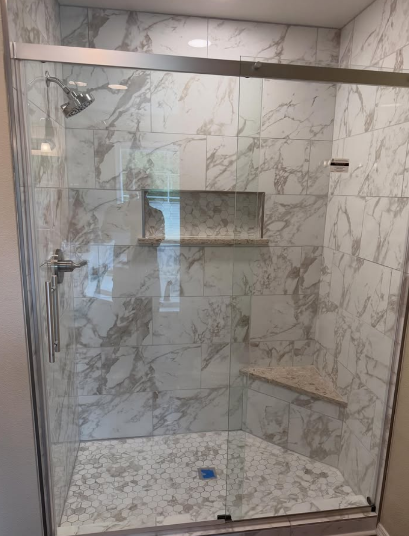 Custom glass shower with designer tile JT Interiors
